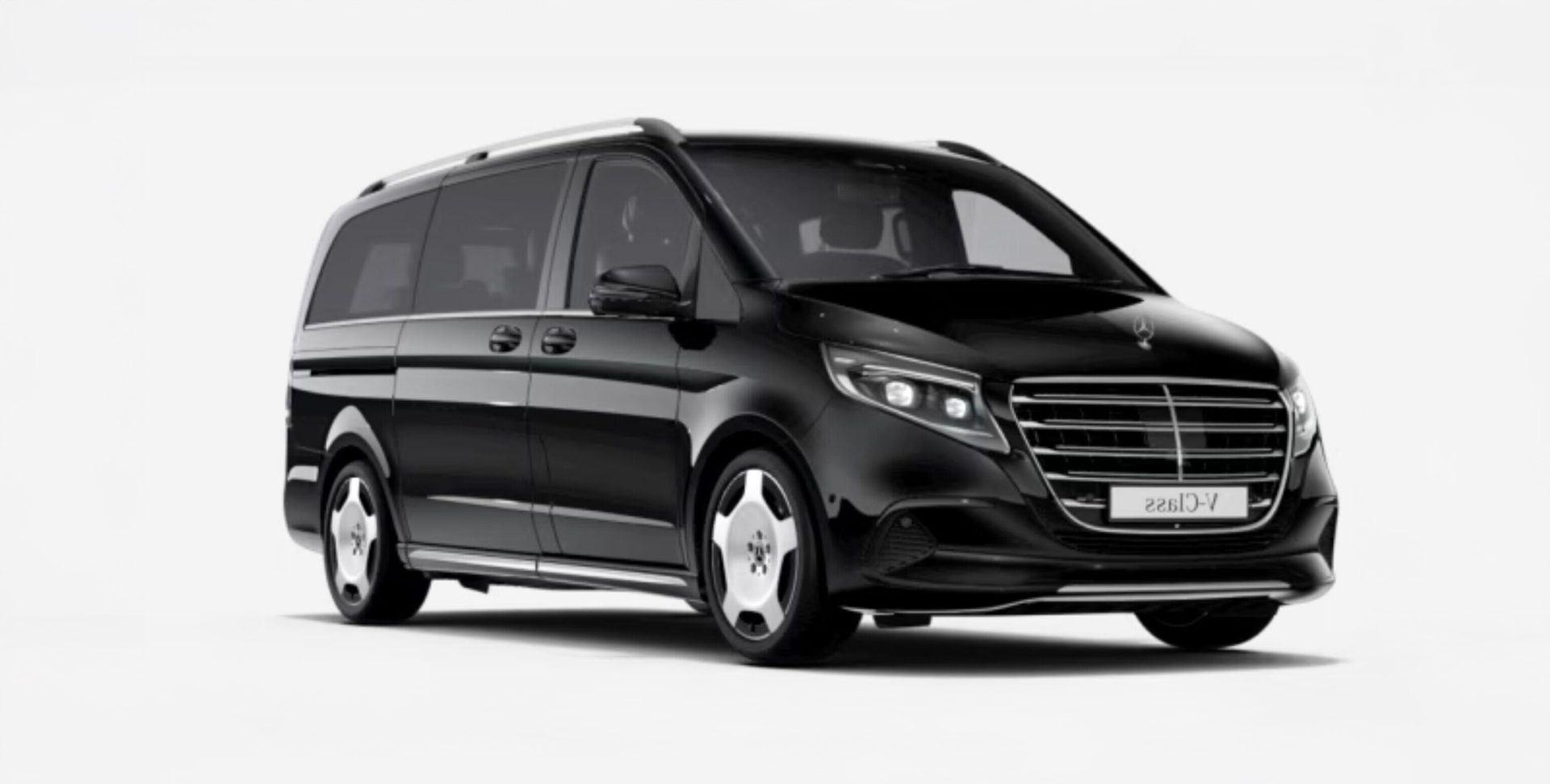 Black luxury van with sleek design and tinted windows.